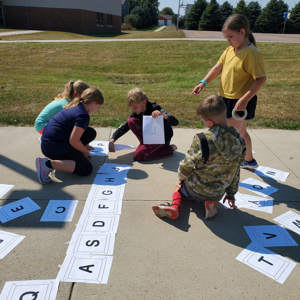 Fourth graders re-creating the keyboard on a beautiful day!